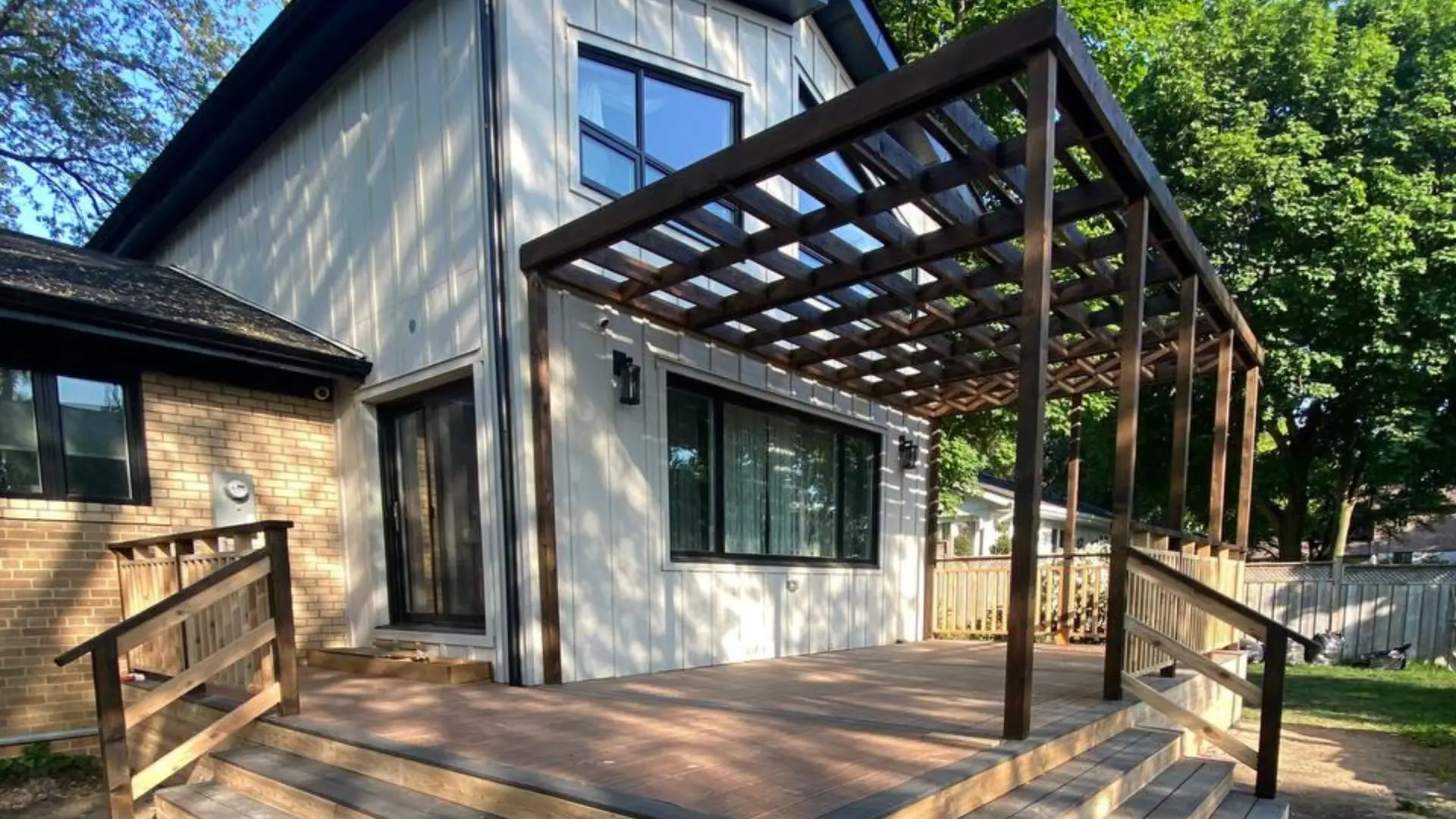 Deck Builder Specialist, Sonce Homes specializes in building quality wood decks, here in this image we have a beautiful wood deck, with a wooden pergola custom built above it, we make everything from scratch,